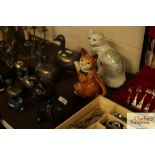 A cat teapot and two other cat ornaments