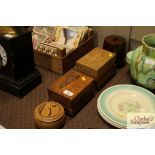 A collection of various wooden boxes and tobacco j