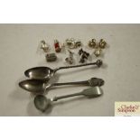 Three various white metal and silver spoons; silve