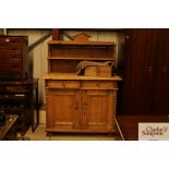 An antique pine chiffonier