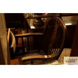 An elm seated stick and wheelback elbow chair; and