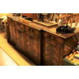 A reproduction mahogany break front sideboard