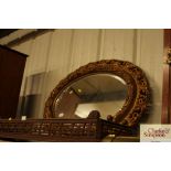 A gilt framed bevel edged wall mirror