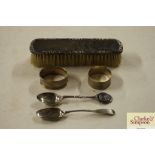 A silver backed brush; two napkin rings and two sp