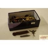 A box of miscellaneous items to include corkscrew,