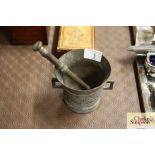 An antique bronze pestle and mortar; dated 1825