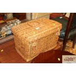 A wicker basket and contents to include a vintage