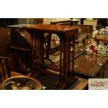 A nest of three mahogany occasional tables