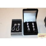 Two pair of boxed diamante earrings