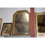 A decorative gilt framed wall mirror