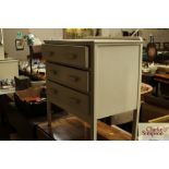 A white painted chest of three drawers