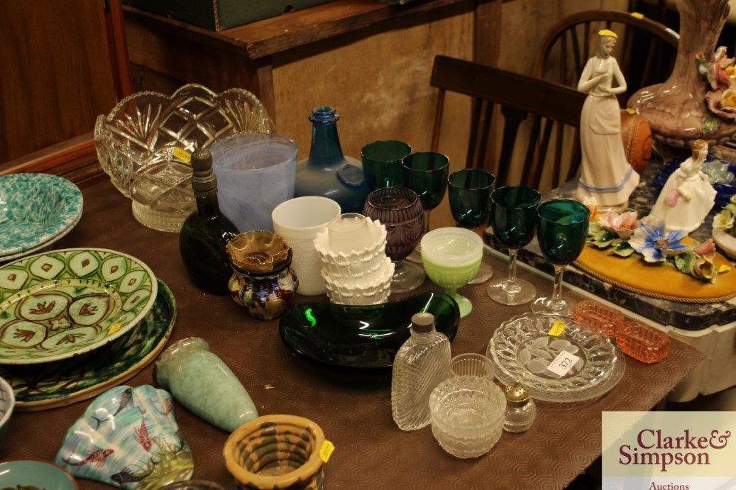 A quantity of various green wine glasses, various