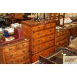 A walnut and herringbone banded chest of two short