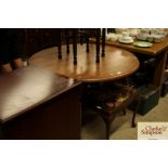 A modern pine drop leaf kitchen table