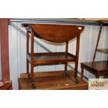 A mahogany drop leaf two tier tea trolley