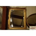 A gilt framed oblong bevel edged wall mirror