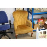 An upholstered nursing chair raised on squat cabri