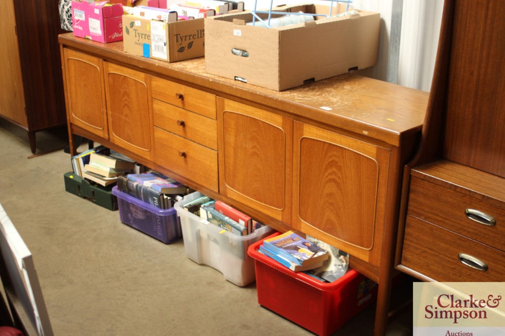 A teak sideboard fitted three central drawers