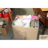 A box of various curtains, materials etc.