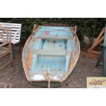 A 6' dinghy with trailer, oars, rollocks and one f