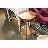 An oak side table with a checker band inlay and ta