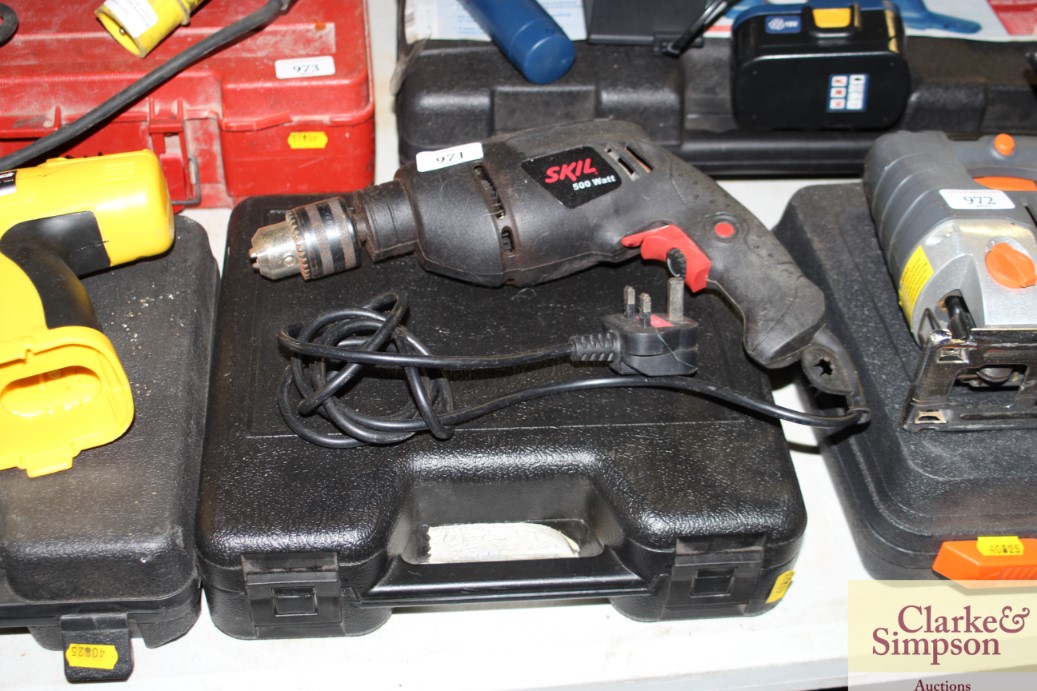 A Skil electric drill together with an Antec drill