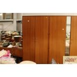 A Meredew two door teak wardrobe