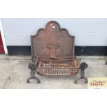 A cast iron fire back and fire grate; and a pair o