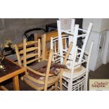 Seven wooden chairs and a wooden stool