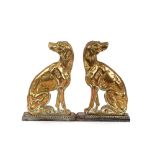 A pair of Victorian cast brass dog door stops, 33cm high