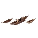 An unusual Ethnic boat model, depicting seated elderly figures; and two others similar (3)