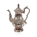 A George III silver coffee pot, Sheffield 1827. of baluster shape with rich foliate embossed