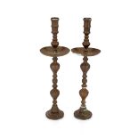 A pair of large decorative brass candlesticks, 92cm high