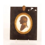 A pair of early 19th Century silhouette portrait profiles, in ebonised and brass mounted frames of a