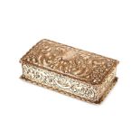 A late Victorian silver hinged box, with profuse foliate scroll decoration and initialled cartouche,