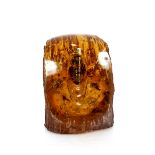 An amber coloured bug decorated paperweight, 10cm high