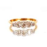 An 18ct gold ring, set five graduated diamonds, 1.5gms total weight, size "L"