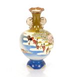 An Oriental baluster vase, decorated figures in a landscape, 28cm high