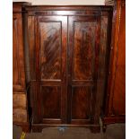 A 19th Century mahogany hanging wardrobe, enclosed by a pair of quarter panel doors, raised on