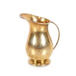 A small silver gilt cream jug, Hallmarked for Birmingham 1963, 9cm high