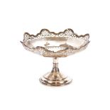 A George V silver comport, having shaped pierced border raised on octagonal spread column and