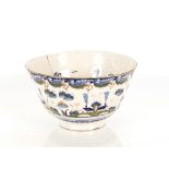 A rare Bristol Delftware polychrome punch bowl, circa 1730, the exterior decorated with four