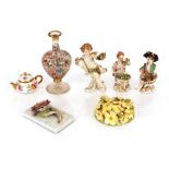 Three Meissen small porcelain figures, a Dresden miniature teapot; a Meissen style flower ornament