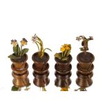 Four miniature bronze flower pots, having flower menu holders