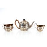A matched George III silver three piece teaset, different dates and makers, circa. London 1802-1803,