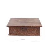 An antique oak Bible box, having foliate carved frieze and iron lock plate initialled M.S., 66cm