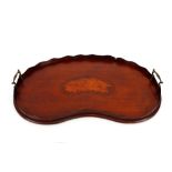 An Edwardian mahogany twin handled tea tray, with conch shell inlaid decoration