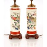 A pair of Satsuma design table lamps, of cylindrical form decorated exotic birds and foliage