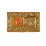 A small brass and enamel "In & Out" sign