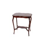 An Edwardian mahogany occasional table, the shaped top raised on bowed supports united by an under